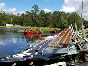 Rescuers and search personnel look for information after Irma