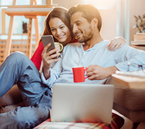 Couple browsing home listings online