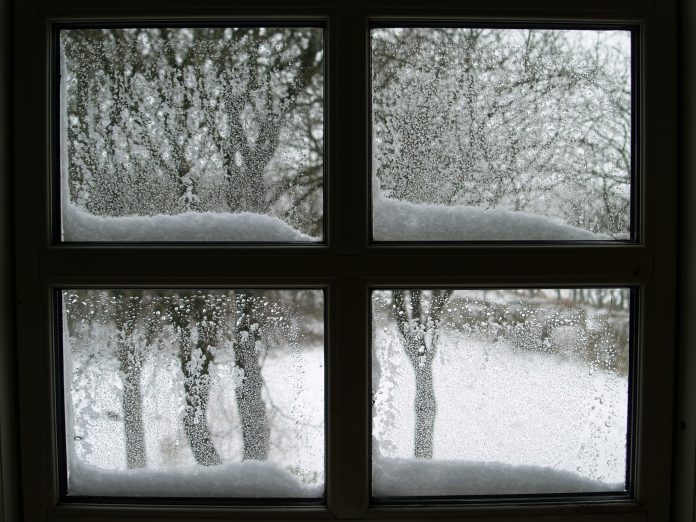 A window looking out onto a snowy scene.