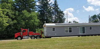 How Much Does It Cost To Move a Mobile Home? Photo of mobile home moving