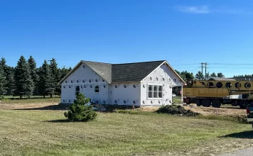 Is It Cheaper to Build or Buy Modular? Photo of a modular home recently installed on a foundation