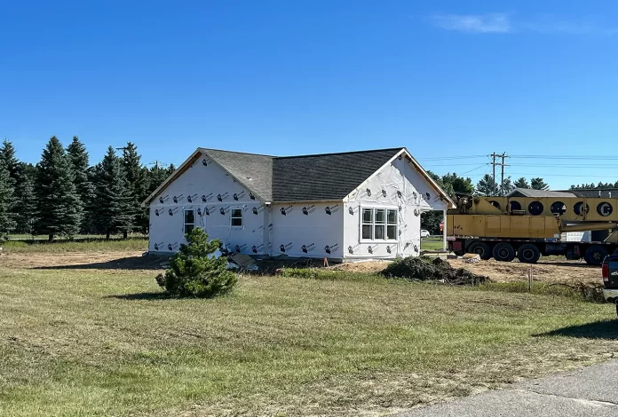 Photo of a modular home recently installed on a foundation