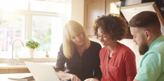 How to Negotiate the Price of a New Mobile Home Photo of people negotiating the price of a home